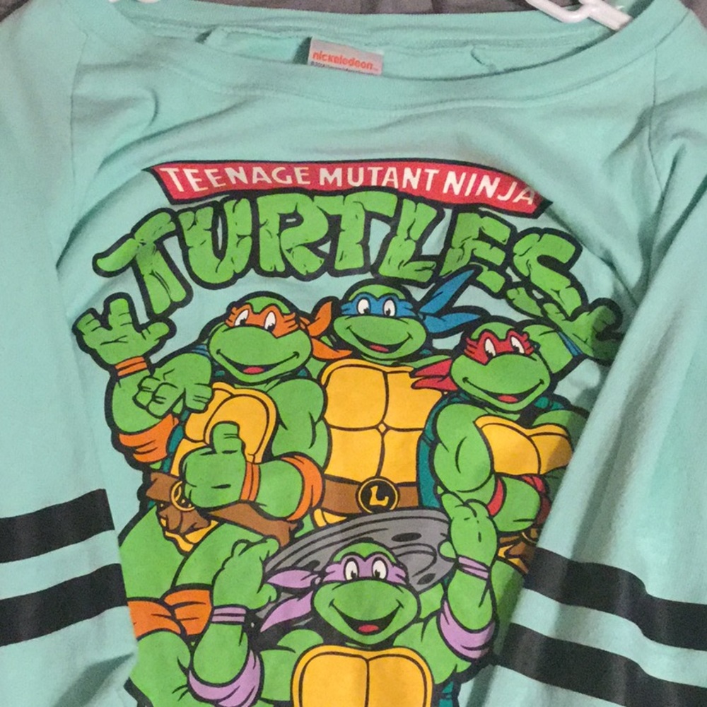 A Nickelodeon tonnage mutant ninja turtles shirt.
